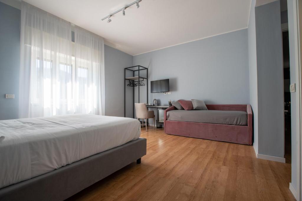 Postel nebo postele na pokoji v ubytování Alma Sorrento Suite