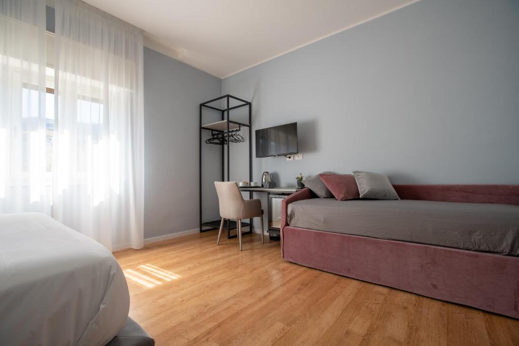Postel nebo postele na pokoji v ubytování Alma Sorrento Suite