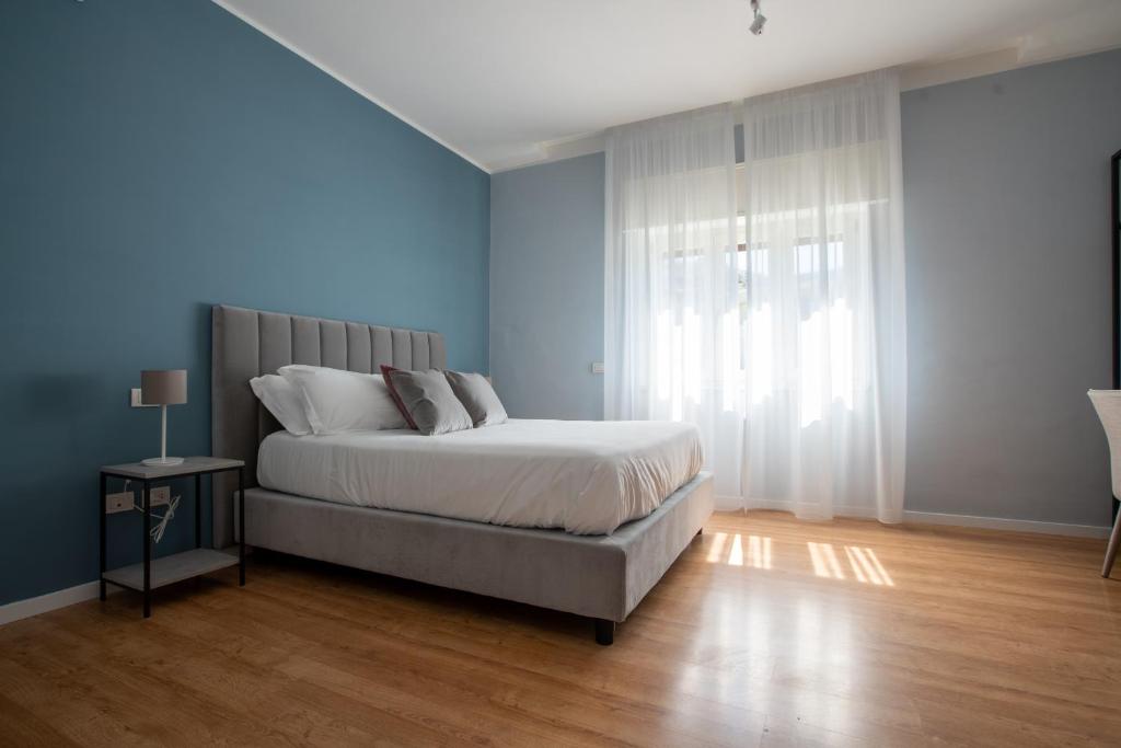Postel nebo postele na pokoji v ubytování Alma Sorrento Suite
