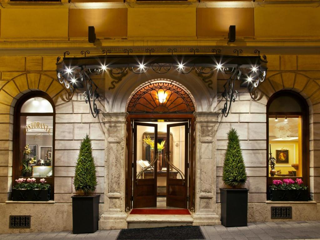 a store front of a building with lights at Albergo Ottocento in Rome