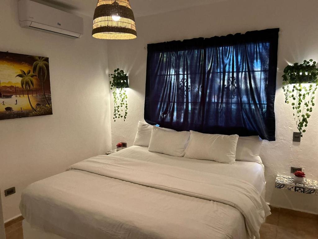 Postel nebo postele na pokoji v ubytování Nuovo Hotel Playa Catalina
