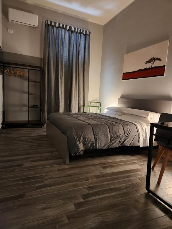 Postel nebo postele na pokoji v ubytování Caio Duilio B&B