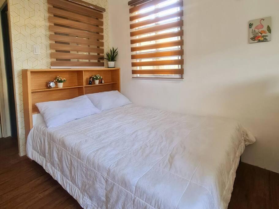 Postel nebo postele na pokoji v ubytování Muji-Inspired, Studio-Type Home at Phirst Park Homes Tanza