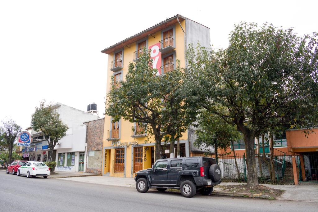 a black truck parked on the side of a street at Hotel Museo Xalapa in Xalapa