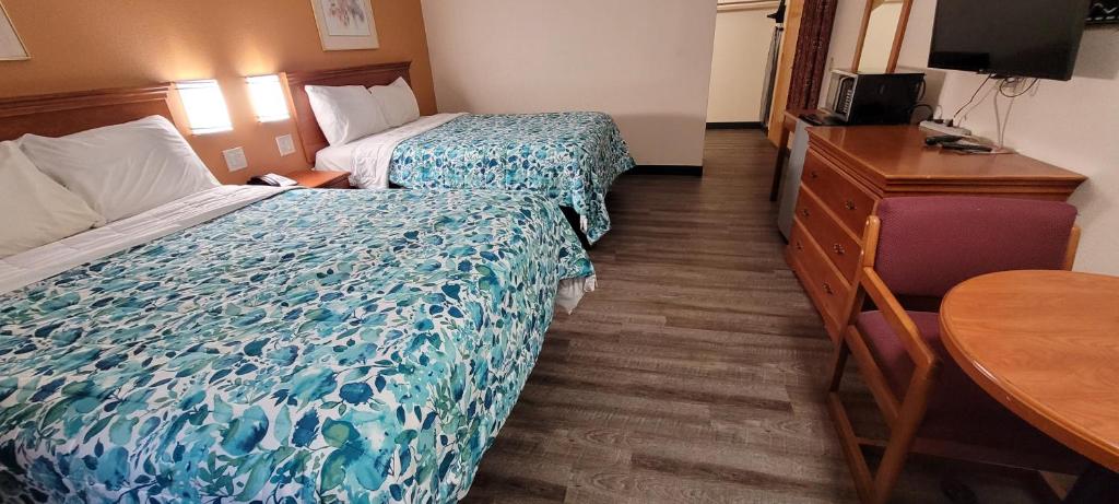 Postel nebo postele na pokoji v ubytování Harvey's Motel SDSU La Mesa San Diego