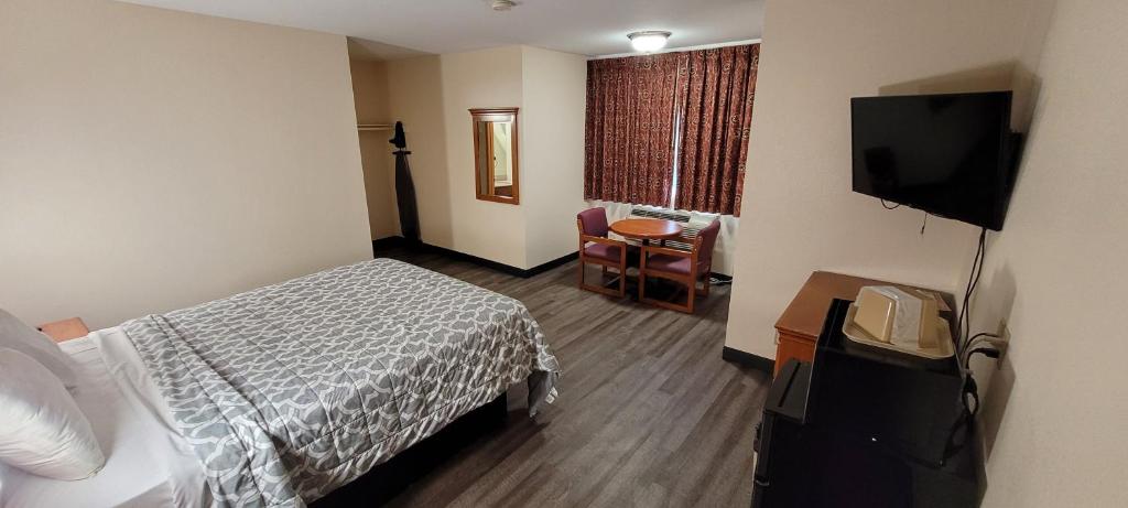 Postel nebo postele na pokoji v ubytování Harvey's Motel SDSU La Mesa San Diego