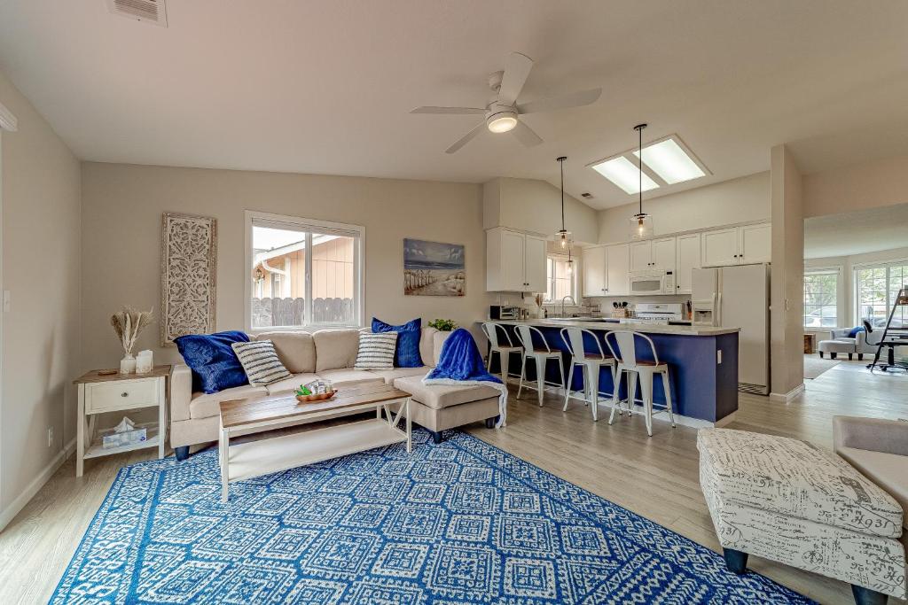 a living room and kitchen with a couch and a table at Cozy Home, Close to Ocean and Redwoods in McKinleyville