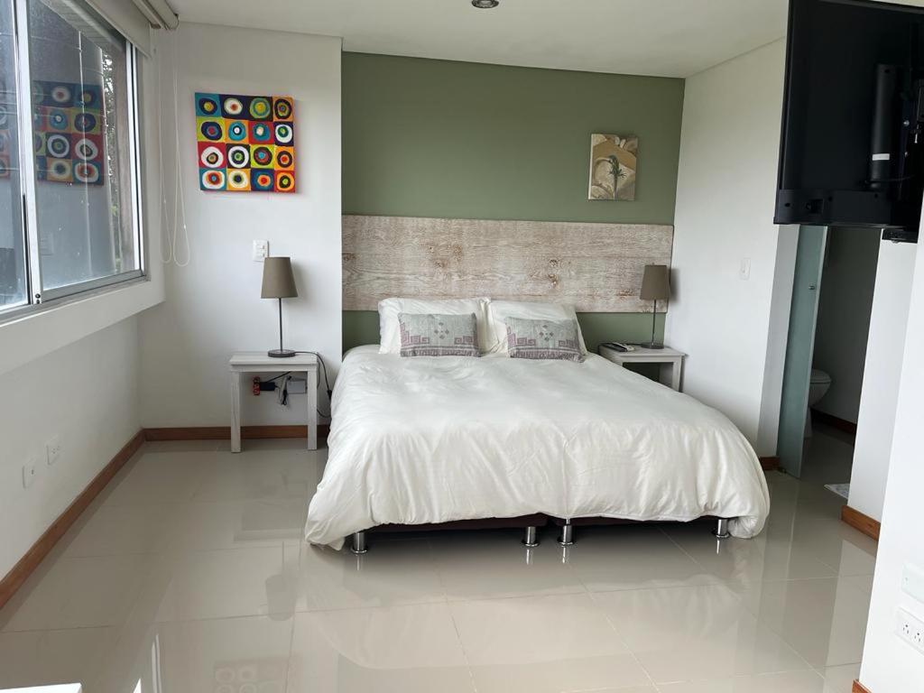 Postel nebo postele na pokoji v ubytování LLanogrande Apartamento Estudio Puerto Bulevar