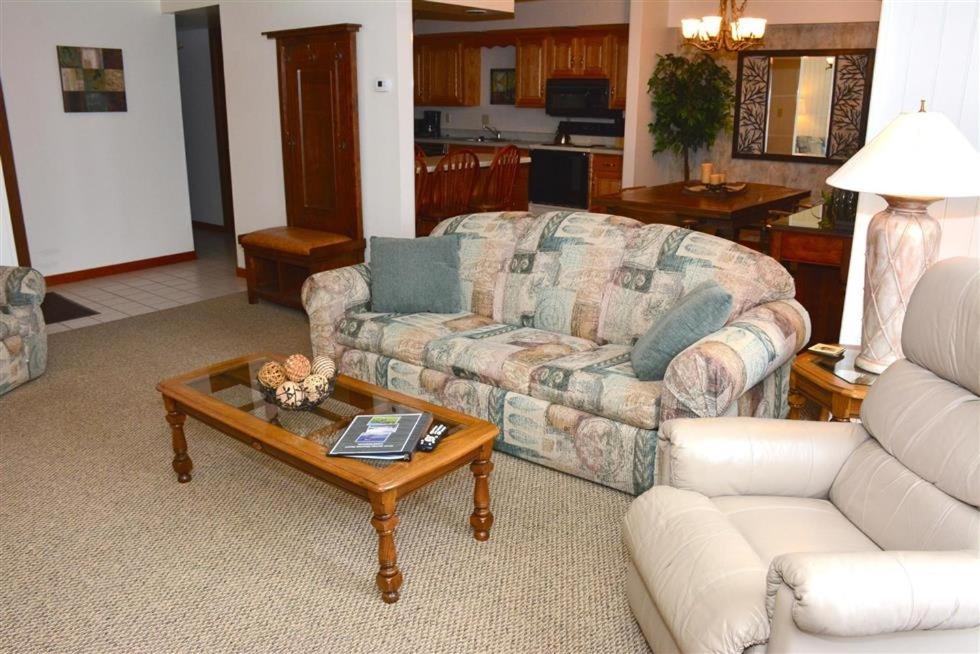 a living room with a couch and a coffee table at Seven Springs Deluxe Condo near Pool in Champion