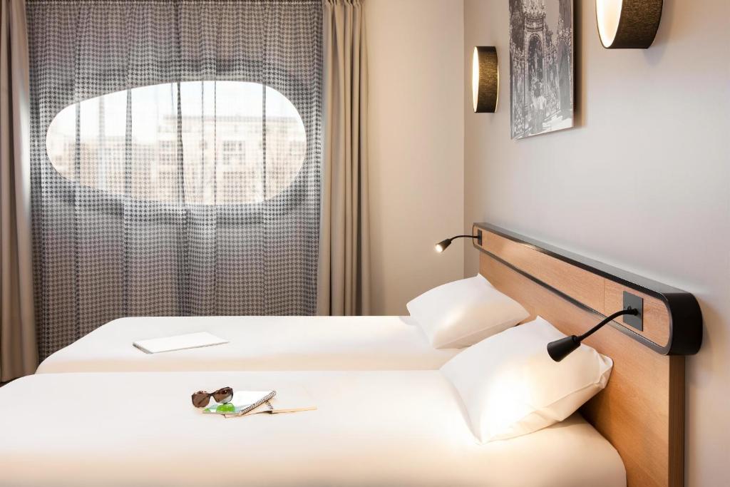 Postel nebo postele na pokoji v ubytování Aparthotel Adagio Access Nancy Centre