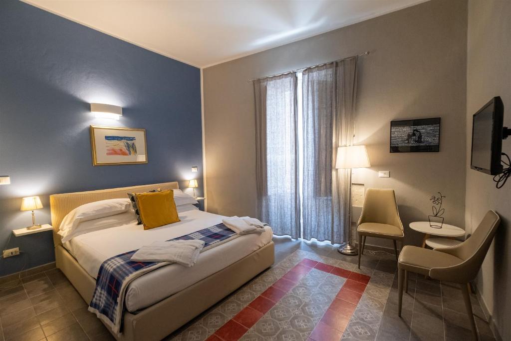 Posteľ alebo postele v izbe v ubytovaní Palazzo Gilistro