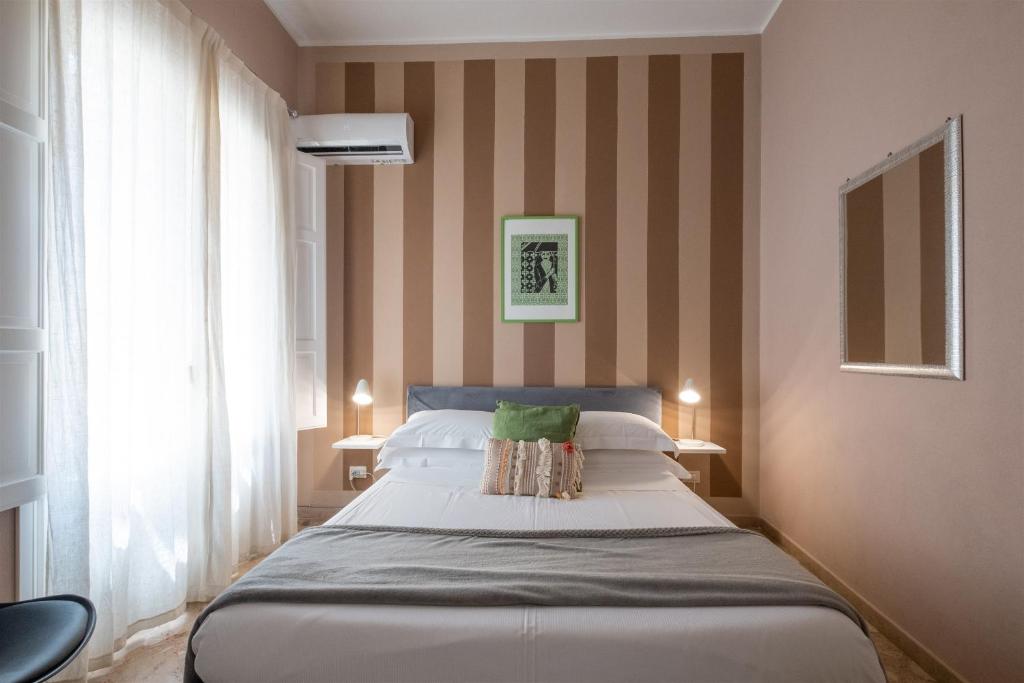 Posteľ alebo postele v izbe v ubytovaní Palazzo Gilistro