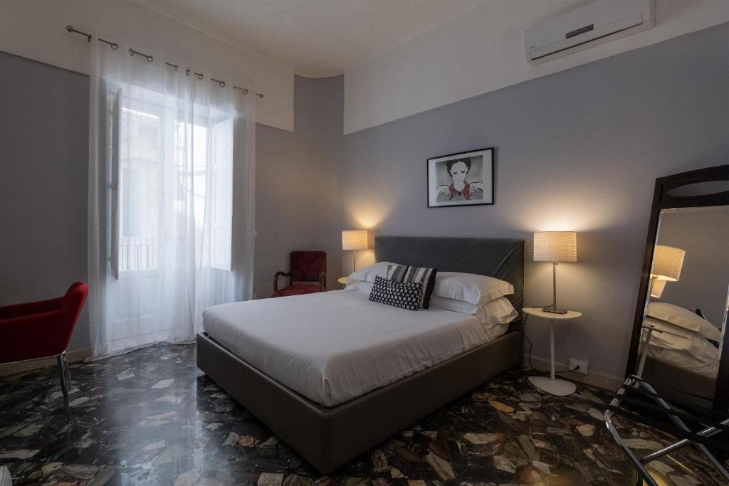 Posteľ alebo postele v izbe v ubytovaní Palazzo Gilistro