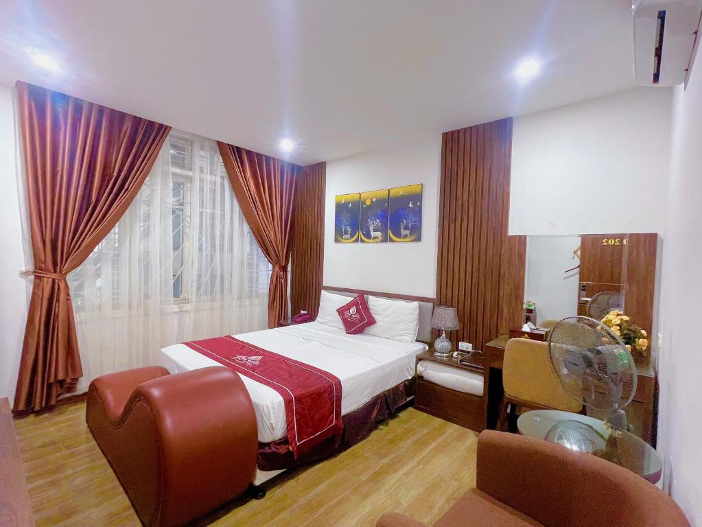 Postel nebo postele na pokoji v ubytování Rosy Motel Trung Yên