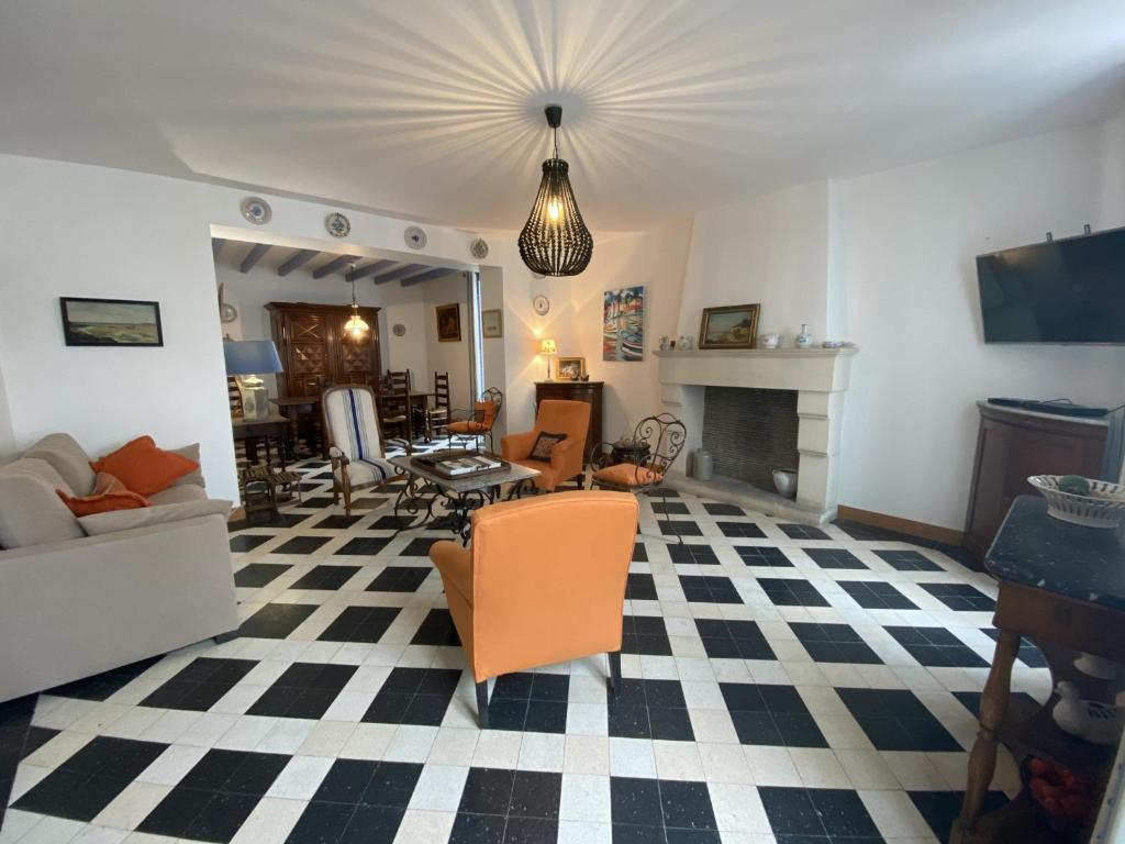 a living room with a couch and a fireplace at Maison Fouras, 6 pièces, 8 personnes - FR-1-709-39 in Fouras