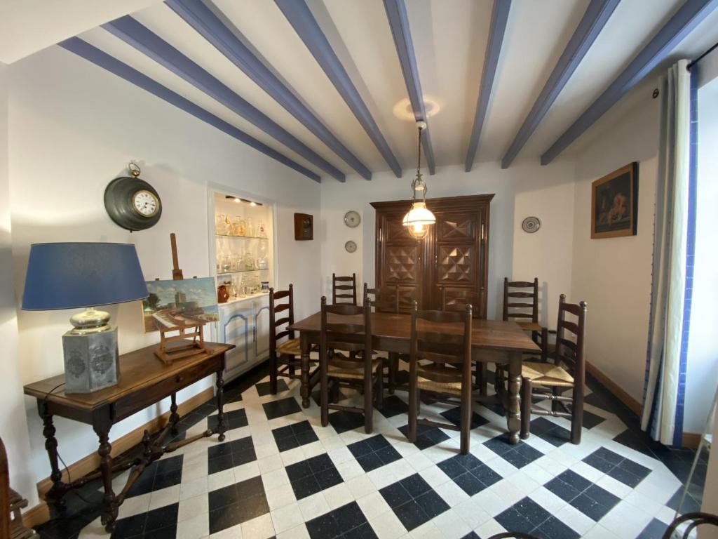 a dining room with a table and chairs at Maison Fouras, 6 pièces, 8 personnes - FR-1-709-39 in Fouras