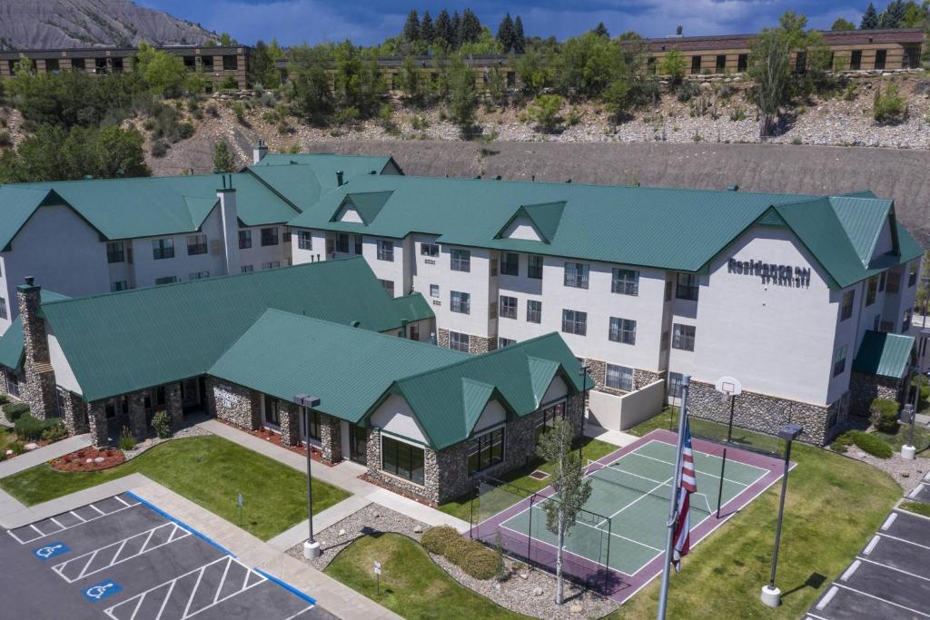 an aerial view of a hotel with a tennis court at Residence Inn Durango Downtown in Durango