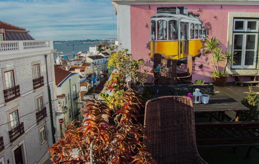 a balcony with a view of a city at Alfama Patio Apartments in Lisbon