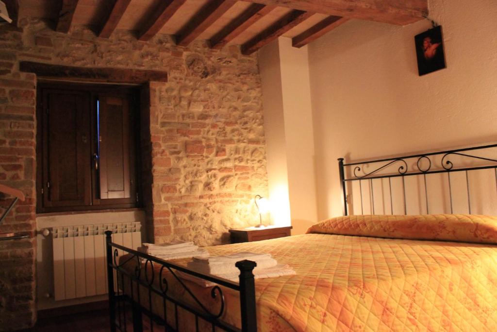 A bed or beds in a room at Il Focolare