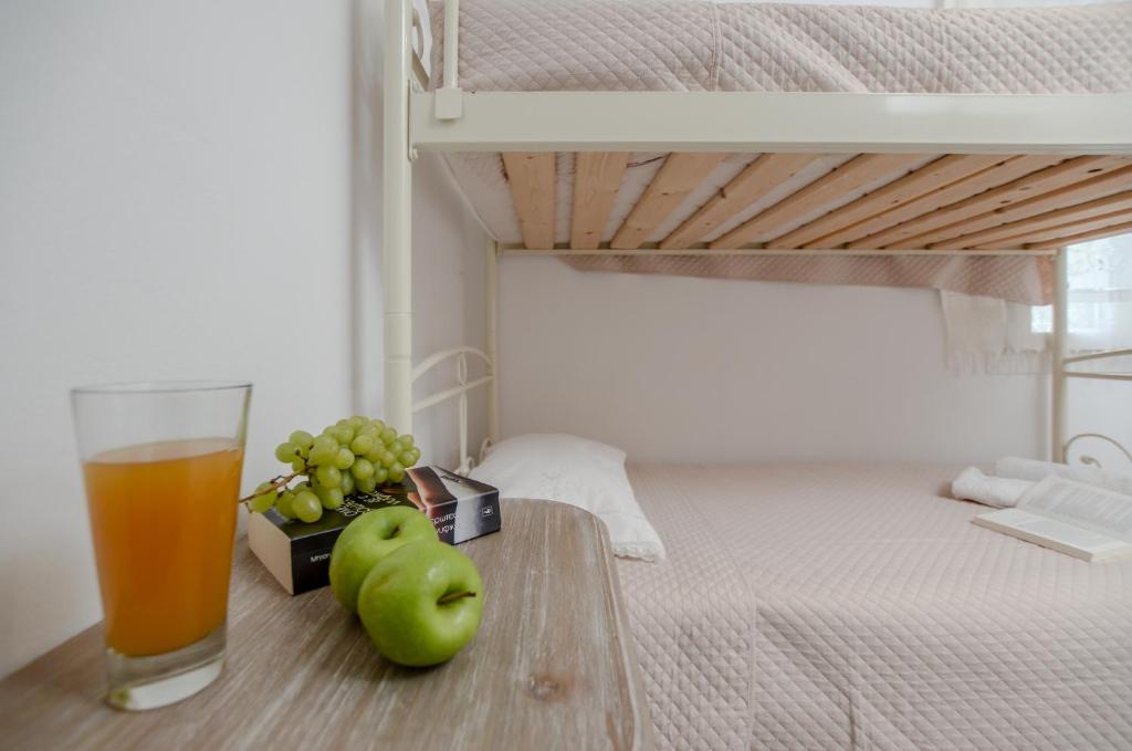 Postel nebo postele na pokoji v ubytování Naxian Wave Seaside Villa