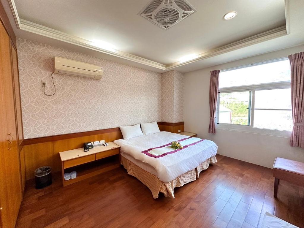 Postel nebo postele na pokoji v ubytování Li Quan Hot Spring Resort