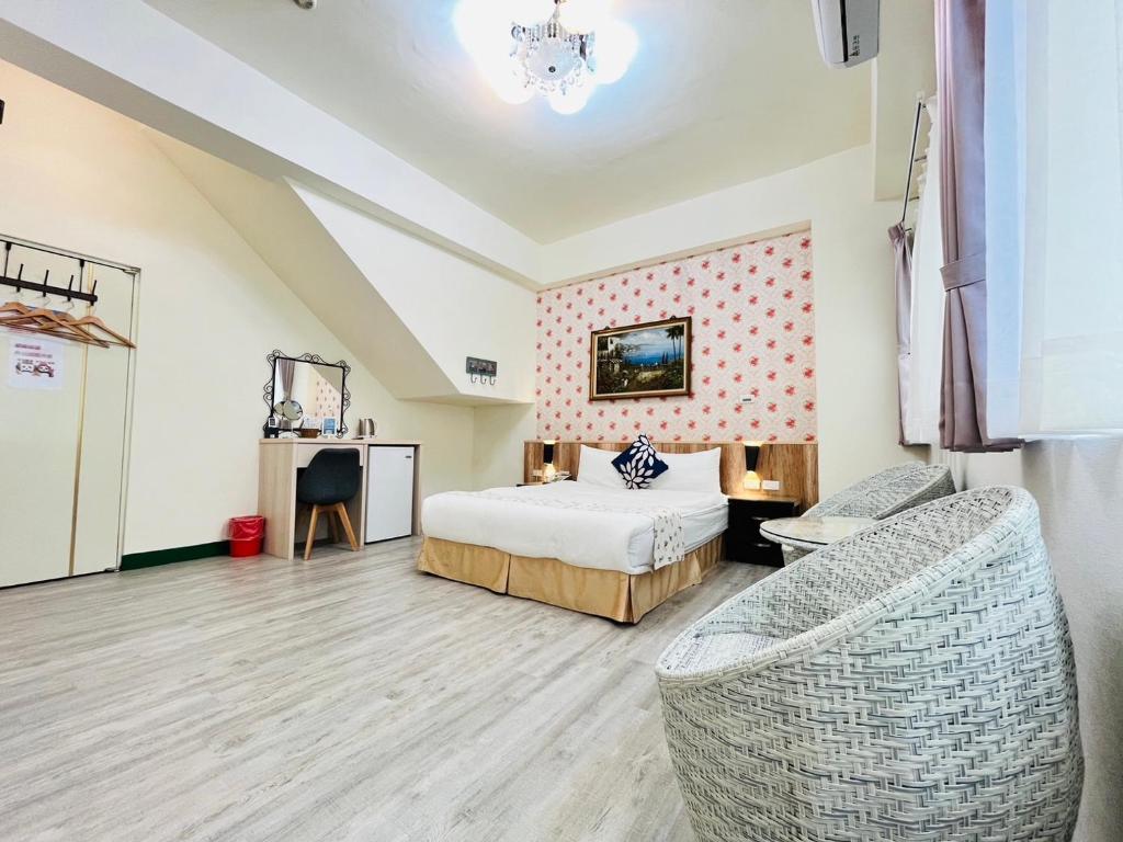 Postel nebo postele na pokoji v ubytování Sweet B&B 幸福微甜民宿