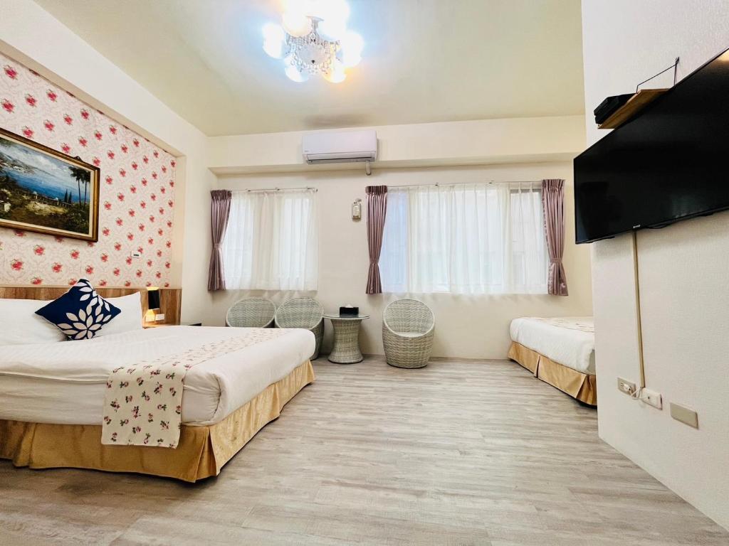 Postel nebo postele na pokoji v ubytování Sweet B&B 幸福微甜民宿