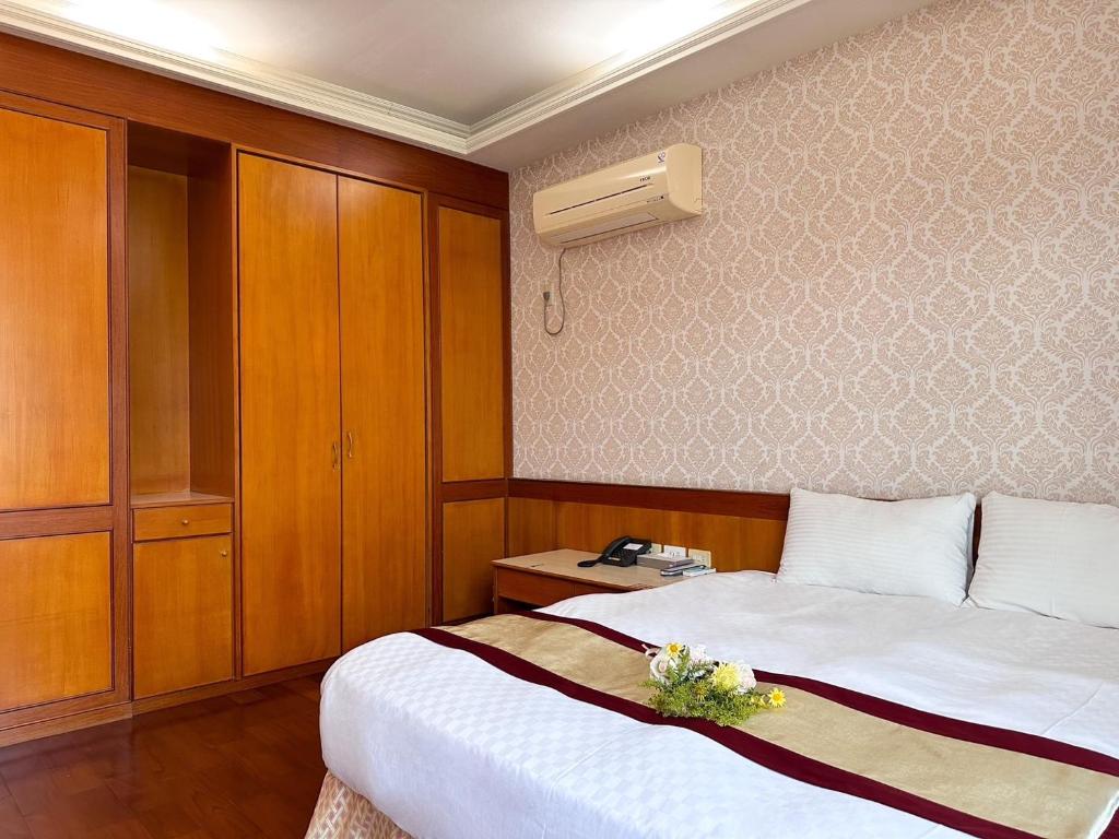 Postel nebo postele na pokoji v ubytování Li Quan Hot Spring Resort