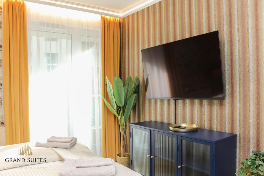 A television and/or entertainment centre at Grand Suites Corvin