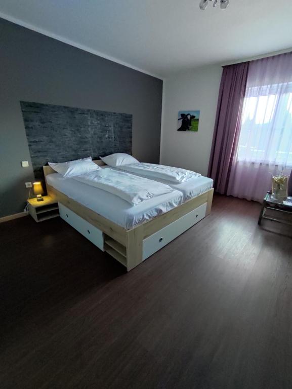 Postel nebo postele na pokoji v ubytování Pension Hoogerland