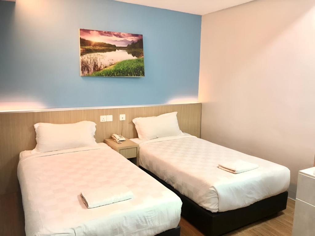 Postel nebo postele na pokoji v ubytování Double Happiness Hotel