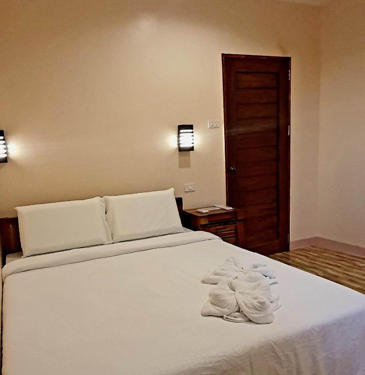 Postel nebo postele na pokoji v ubytování TAGBALAYON Lodging House