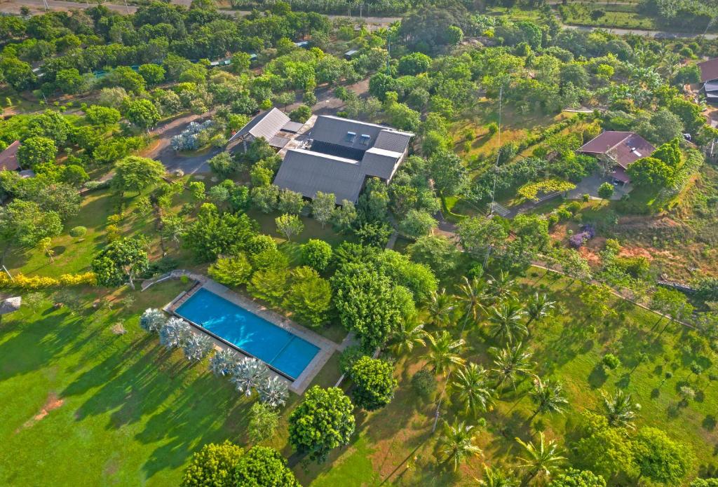 an aerial view of a house with a swimming pool at Birds Resort Hambantota in Hambantota