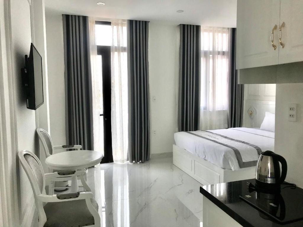 Postel nebo postele na pokoji v ubytování PARIS HOTEL