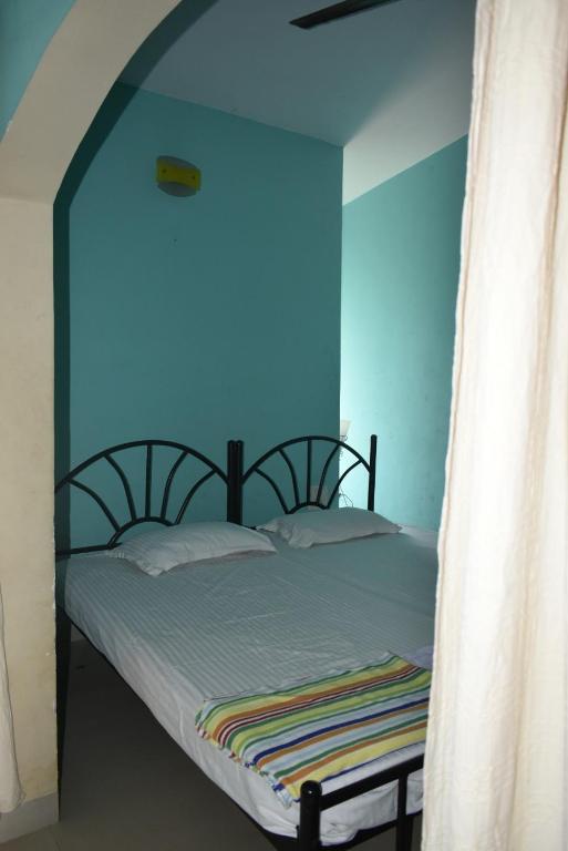 Postel nebo postele na pokoji v ubytování Casa Domingos Guest House