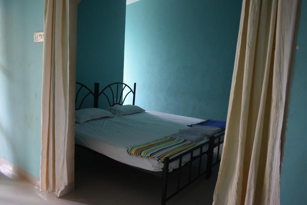 Postel nebo postele na pokoji v ubytování Casa Domingos Guest House