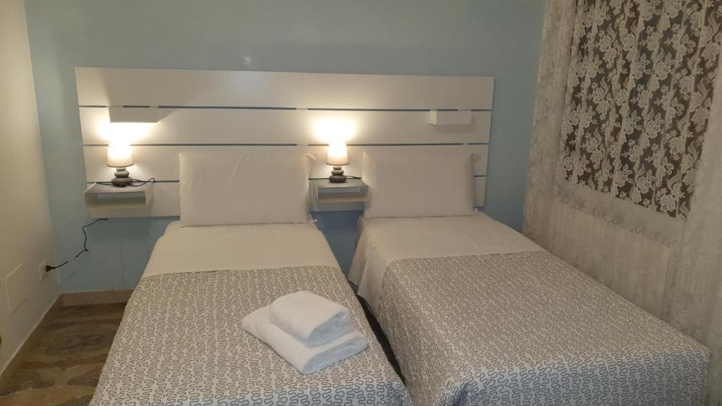 Postel nebo postele na pokoji v ubytování Casa del Pozzo