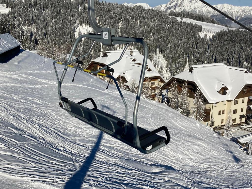 a ski lift going up a snow covered mountain at Appartment Silvia Nassfeld in Sonnenalpe Nassfeld