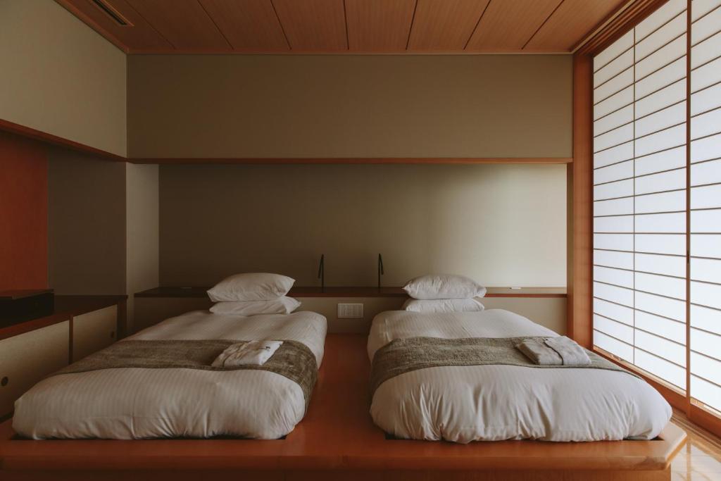 Postel nebo postele na pokoji v ubytování Kanaya Hotel Kinugawa