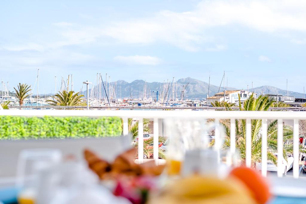 a balcony with a view of a marina with boats at Apartment Veronica-Puerto Pollensa in Port de Pollensa