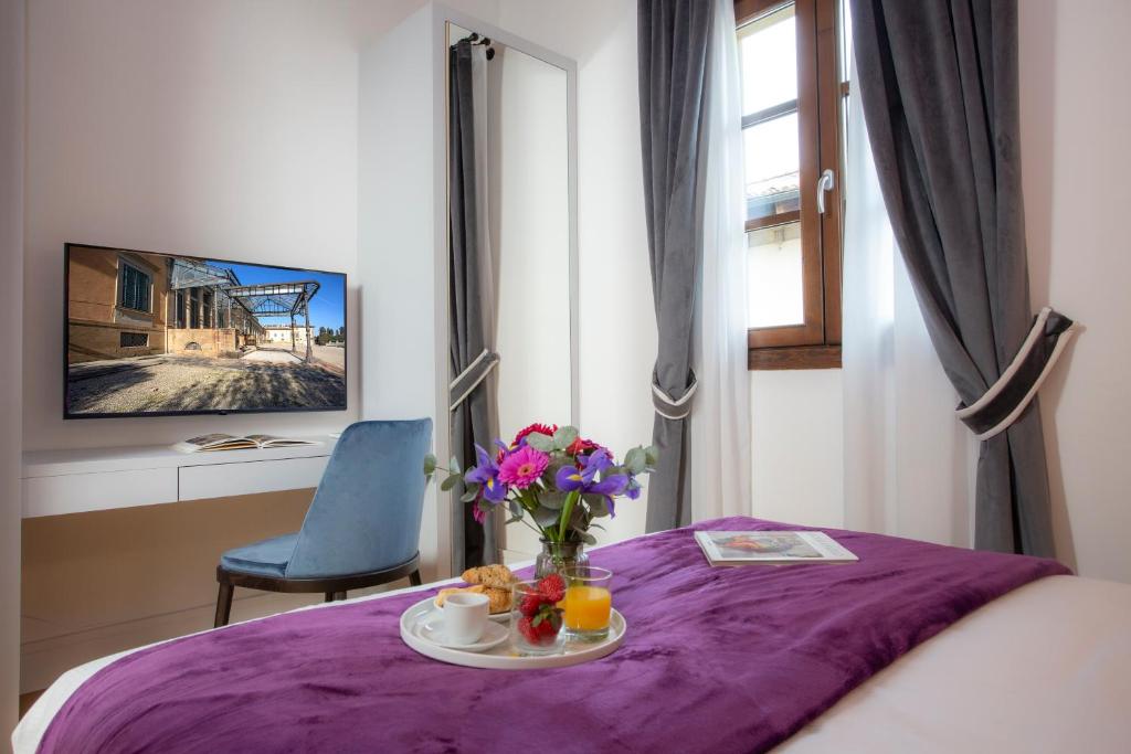 Televízia a/alebo spoločenská miestnosť v ubytovaní Casual Rinascimento Firenze