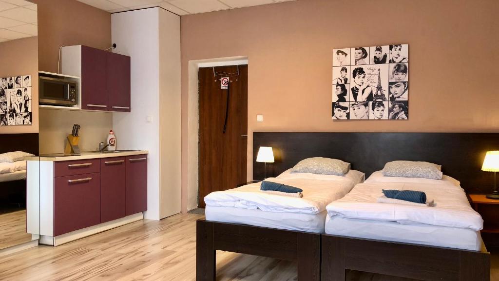 Postel nebo postele na pokoji v ubytování Pension Village