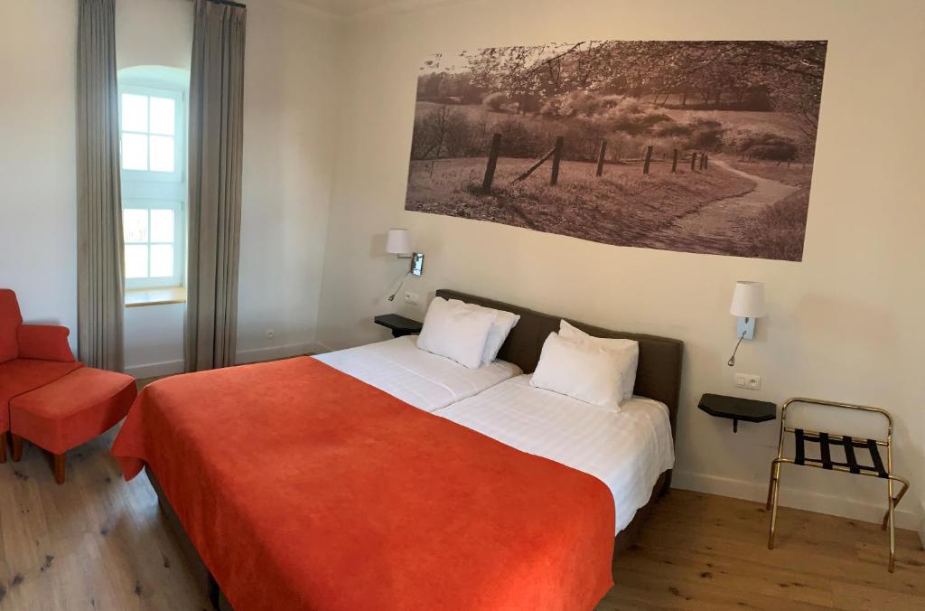 Postel nebo postele na pokoji v ubytování Hof de Draeck Bed & Breakfast
