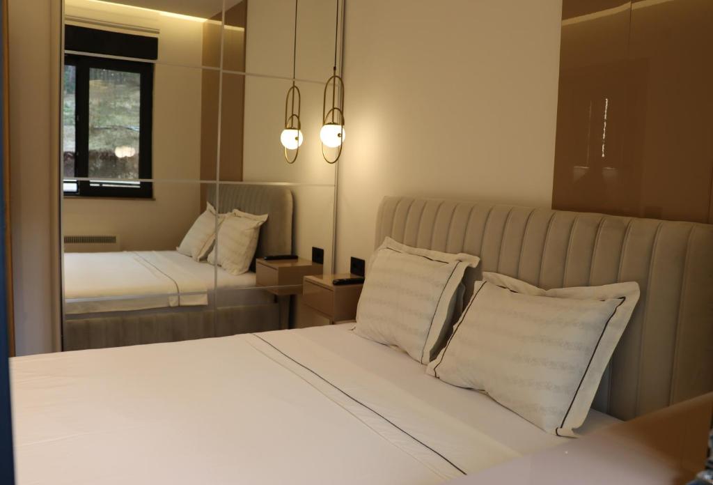 Postel nebo postele na pokoji v ubytování Lazarevic Lux - Vila Pekovic