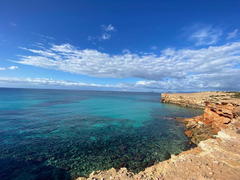 a view of the ocean from a cliff at Hotel Rosamar - Emar Hotels in Es Pujols