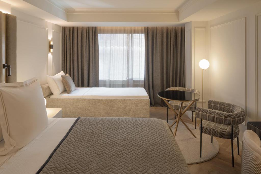 Postel nebo postele na pokoji v ubytování Hotel MIM Andorra