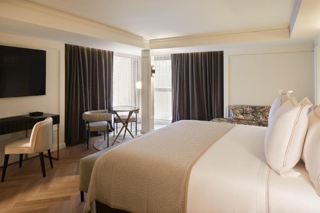 Postel nebo postele na pokoji v ubytování Hotel MIM Andorra