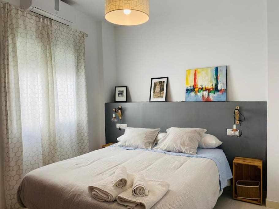Posteľ alebo postele v izbe v ubytovaní Acogedor Apartamento en el Centro de Málaga