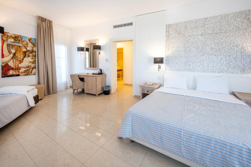 Posteľ alebo postele v izbe v ubytovaní Orizontes Hotel Santorini