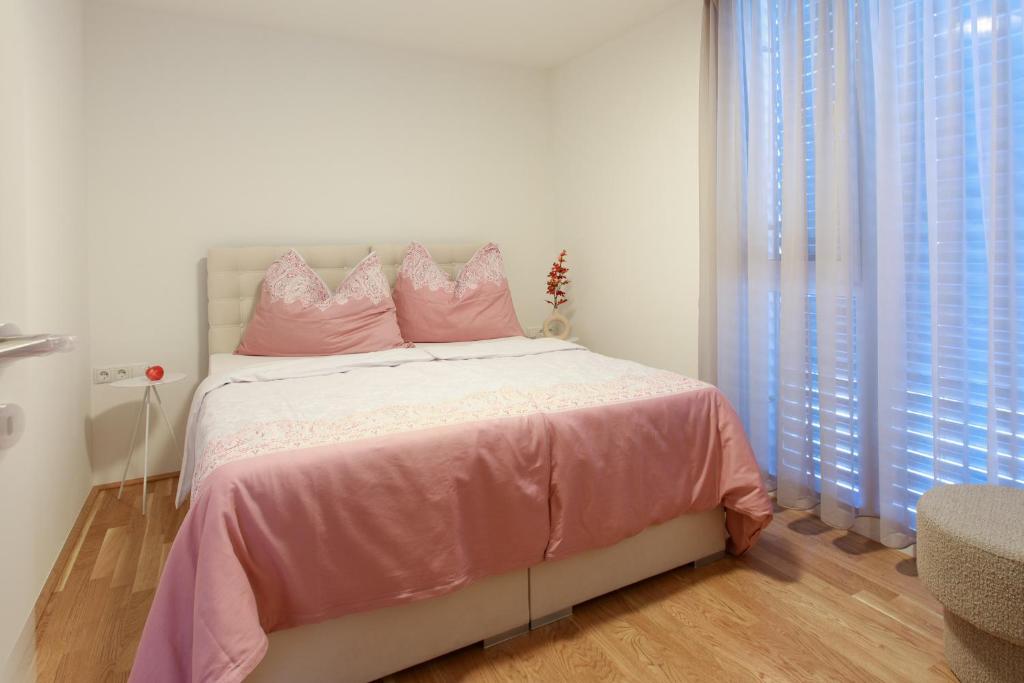 Postel nebo postele na pokoji v ubytování Wohlfühlapartments in Hard